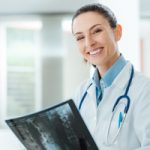 Female doctor holding xray - Diagnostic Radiology at North Mississippi Primary Health Care